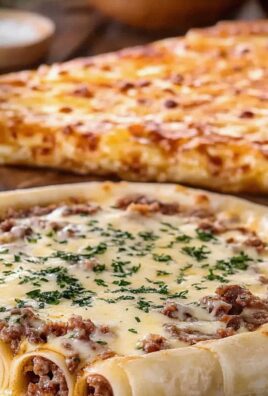 Pyszne roladki pizzowe z mięsem i serem – idealna przekąska!